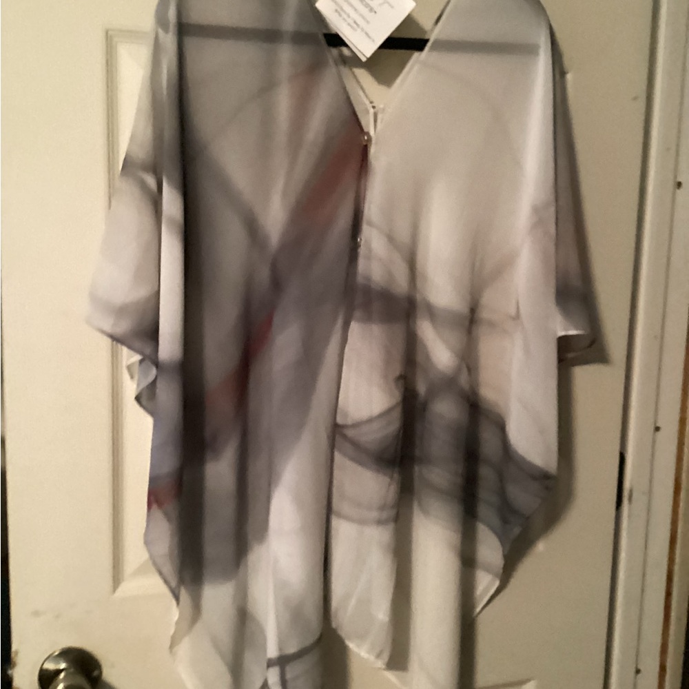 Extremely versatile top in soft dove grays, never worn.